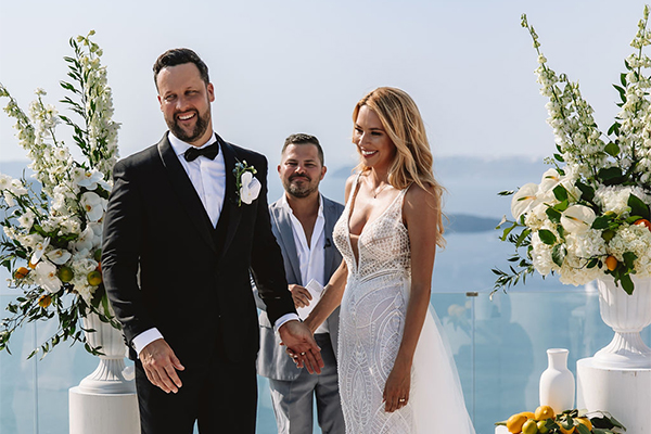Romantic destination wedding in Santorini with pops of orange | Danielle & Garryn